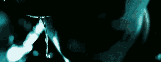a close up of a person 's face with water dripping out of it
