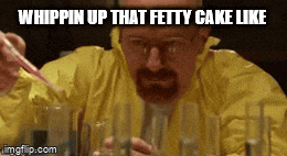 a man in a yellow jacket is whipping up a cake like