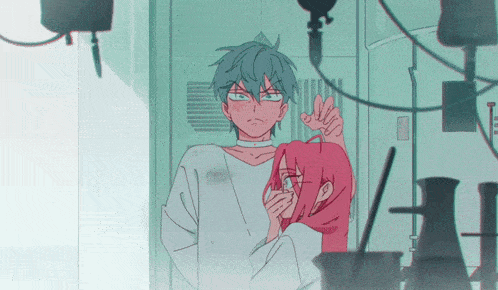 a man and a woman are standing next to each other in a room
