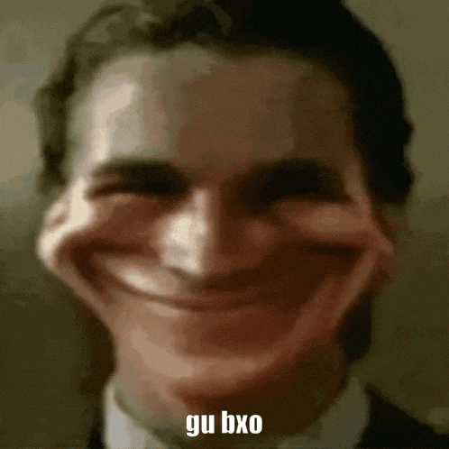 a close up of a man 's face with a funny face and the words `` gui bxo '' written on it .