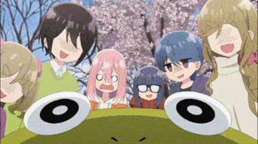 a group of anime characters are looking at a frog with two circles on its head