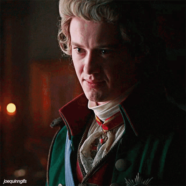 a close up of a man 's face with the words joequinngifs below him