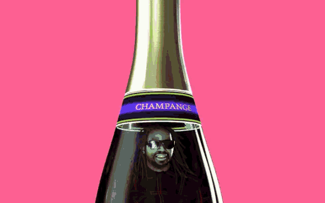 a man 's head is sticking out of a champagne bottle cork