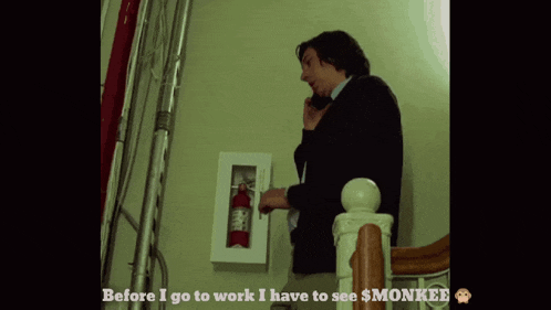 a man talking on a cell phone in front of a fire extinguisher which says before