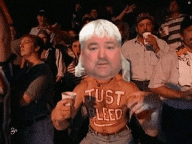 a man with a shirt that says just bleed