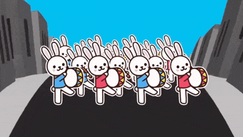 a bunch of rabbits are walking down the street