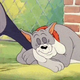 a cartoon cat and dog are laying on the grass .