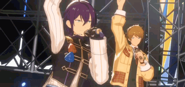 a couple of anime characters are dancing on a stage .