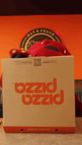 a pizza box that says pizza on the front