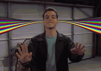 a man in a black jacket is standing in front of a garage door with a rainbow behind him