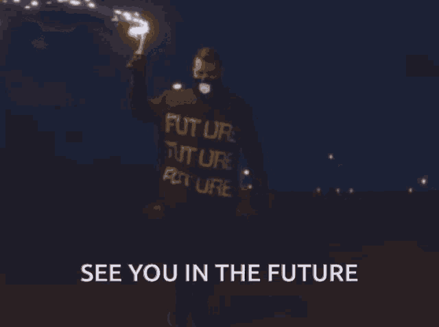 a man in a futuristic sweater says " see you in the future " while holding sparklers