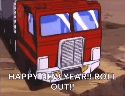 a transformers truck is driving down a dirt road and says `` happy new year ! roll out ! ''