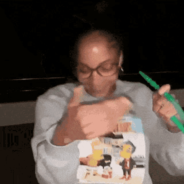 a woman wearing glasses and a shirt that says ' snoop dogg ' on it