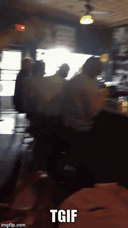 a group of people are dancing in a dark room with the words tgif above them