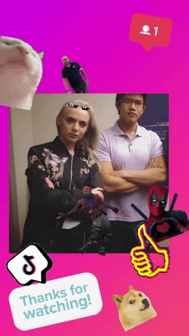 a man and a woman standing next to each other with a thumbs up and a sticker that says thanks for watching