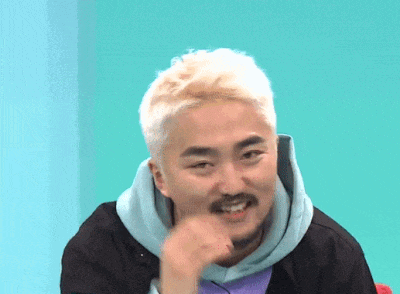 a man with blonde hair and a beard is making a face