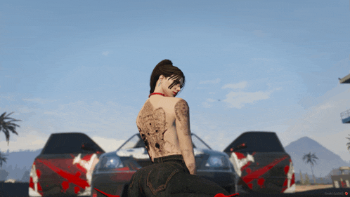 a girl with a tattoo on her back is sitting in front of a car