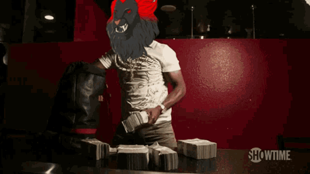 a man with a lion 's head is standing in front of stacks of money sponsored by showtime
