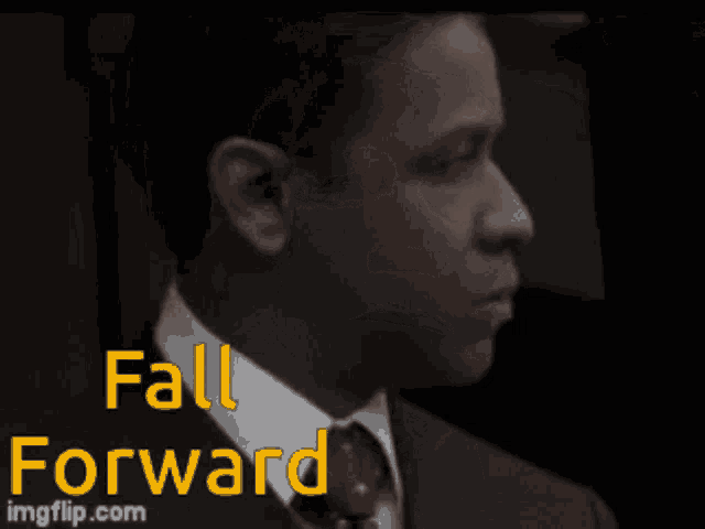 a man in a suit and tie with the words " fall forward " on the bottom