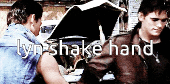 two men standing next to each other with the words " lyn shake hand " on the bottom right