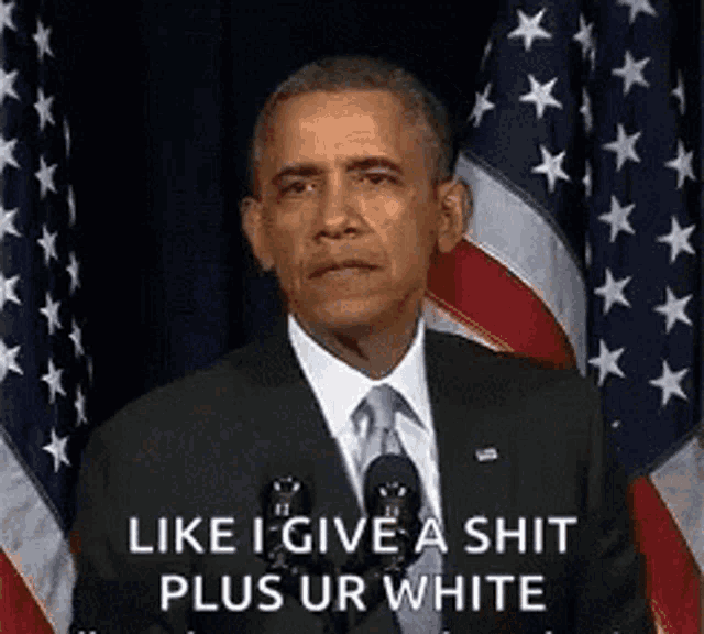 barack obama is giving a speech in front of an american flag and says " like i give a shit plus ur white "