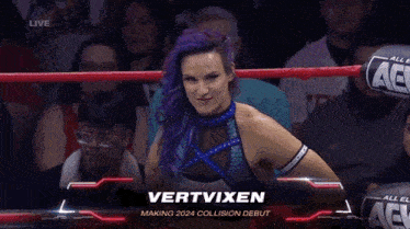 a woman with purple hair is standing in a wrestling ring with the name vertvixen