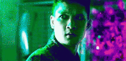 a pixelated image of a man 's face with a purple background