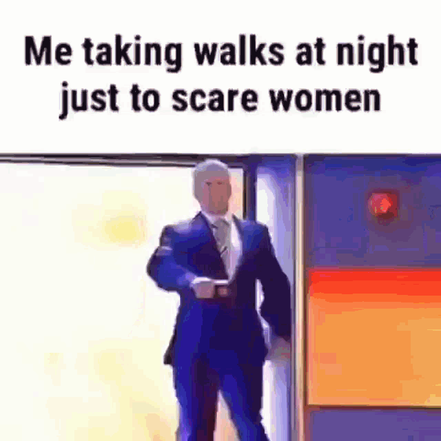 a man in a suit and tie is standing in front of a door .