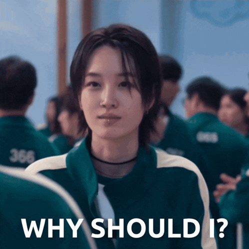 a woman in a green jacket with the words why should i on it