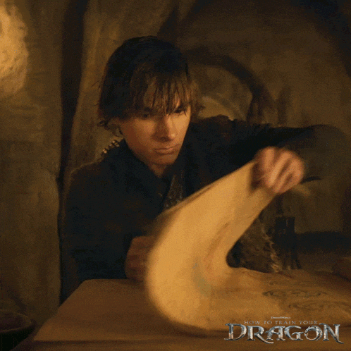 a poster for how to train your dragon shows a man holding a book