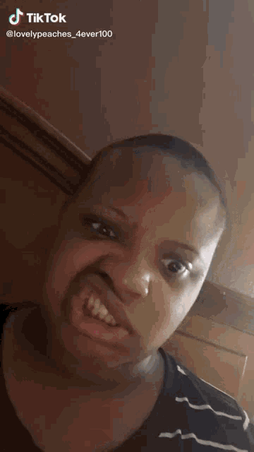 a woman is making a funny face with a tiktok watermark