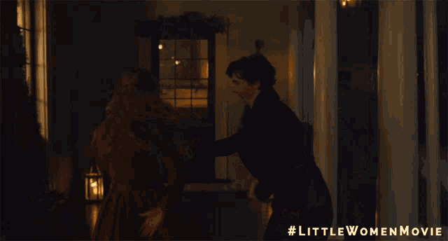 a little women movie poster shows a man and a woman dancing in a dark room