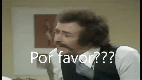 a man with a mustache says por favor in front of a picture