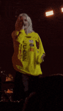 a person in a yellow shirt that says lulu ban on it