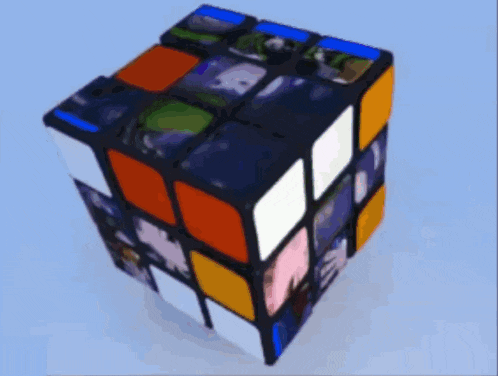 a colorful rubik 's cube on a blue surface