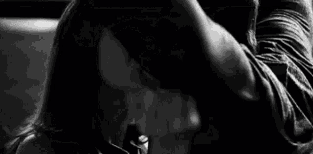 a close up of a person 's face with a black and white photo .