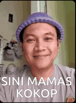 a man wearing a purple hat and a grey shirt with the words " sini mamas kokop "