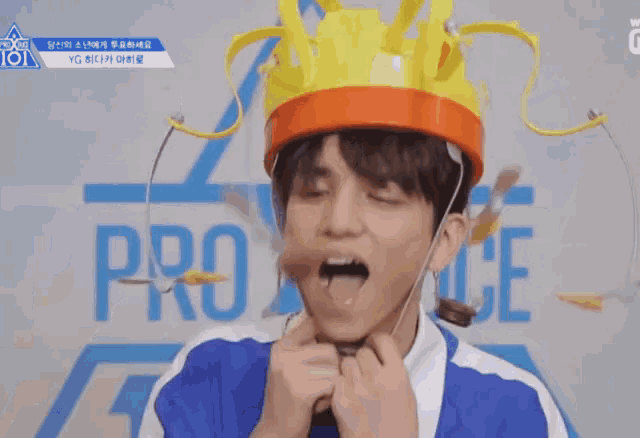 a young man wearing a crown with the word produce on the bottom right