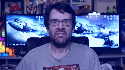 a man wearing glasses and a shirt that says ' a ' on it