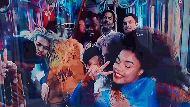 a group of people are posing for a picture on a train