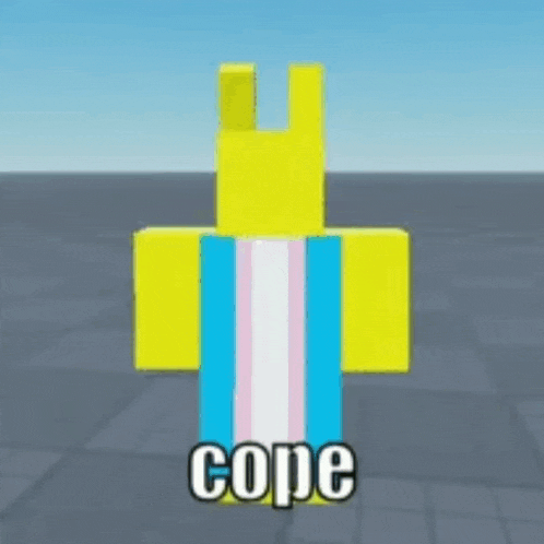a yellow block with a transgender flag on it is standing on a brick floor .