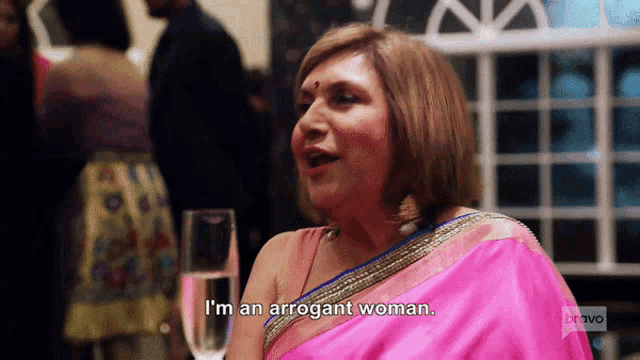 a woman in a pink sari says i 'm an arrogant woman on bravo