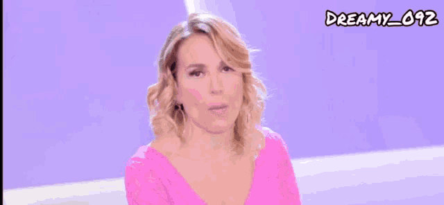a woman in a pink dress with the words mooolto seriamente written below her