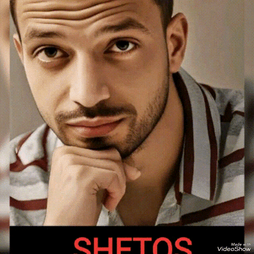 a close up of a man 's face with the word shetos in red on the bottom