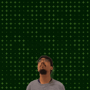 a man with glasses stands in front of a green background with the number 3:11