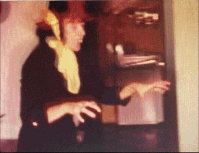 a blurry picture of a man wearing a red hat
