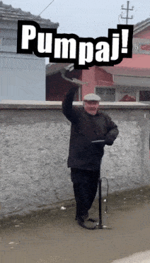 a man with a cane and a sign that says pumpaj on it