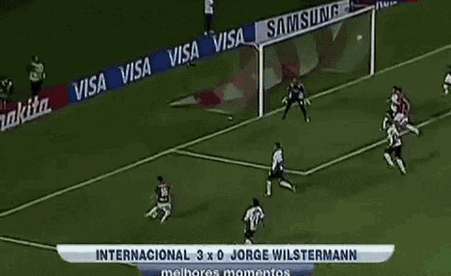 a soccer game is being played on a field sponsored by bridgestone