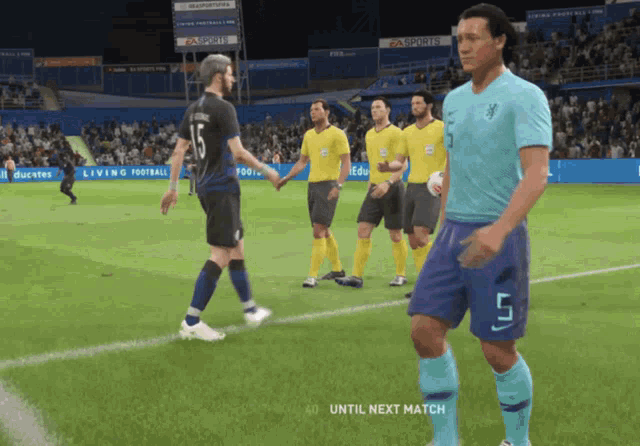 a soccer player with the number 5 on his shorts is standing on the field
