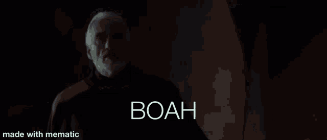 a man in a black coat is standing in front of a blue lightning bolt with the word boah on it .